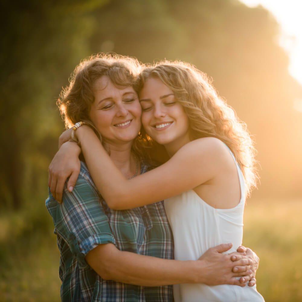 Mother and daughter embracing each other