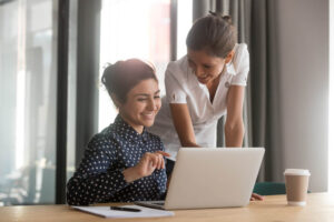 Friendly caucasian female mentor manager supervise indian intern